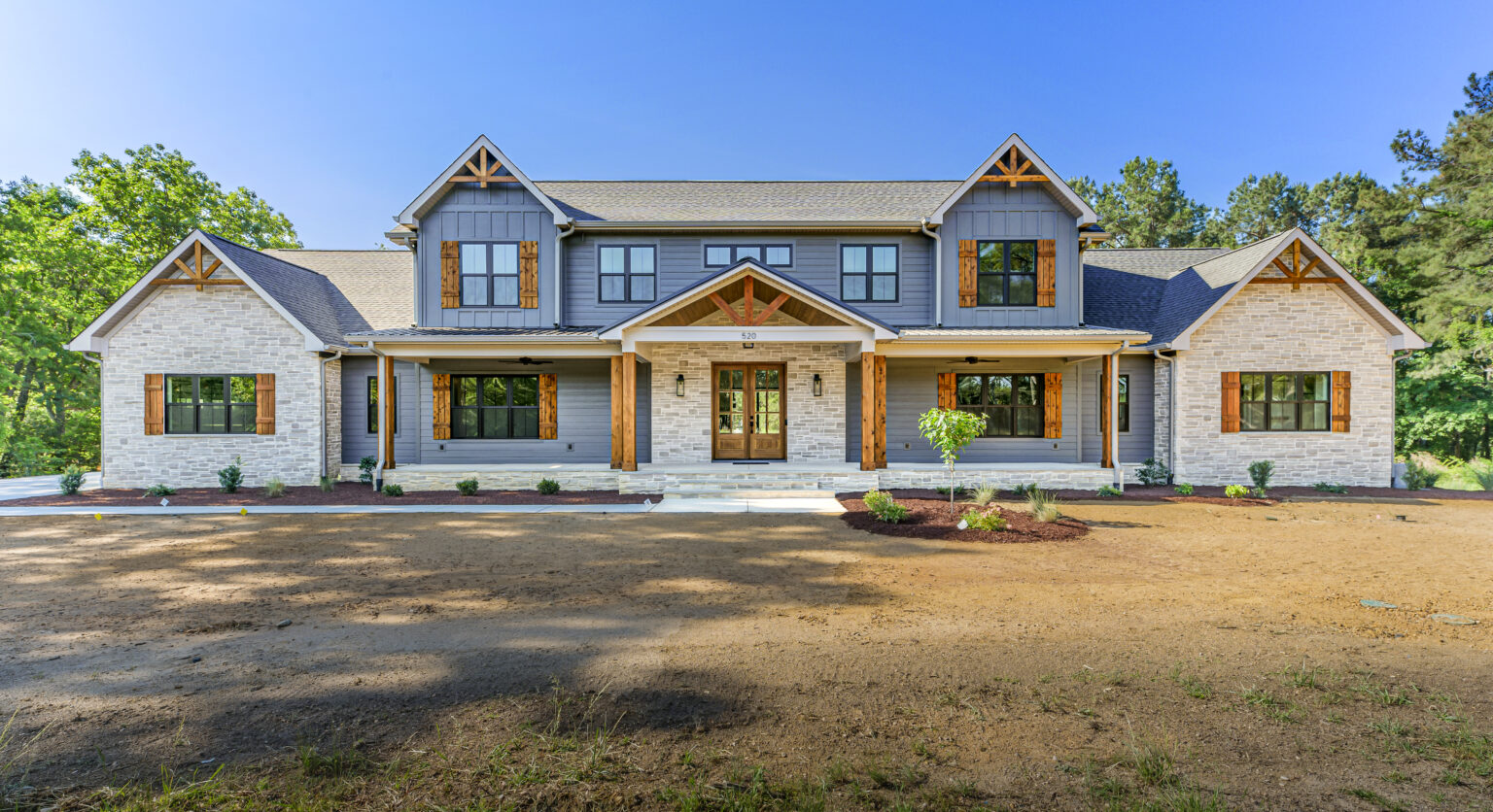 Finished front exterior of a warm modern custom home in West End, NC
