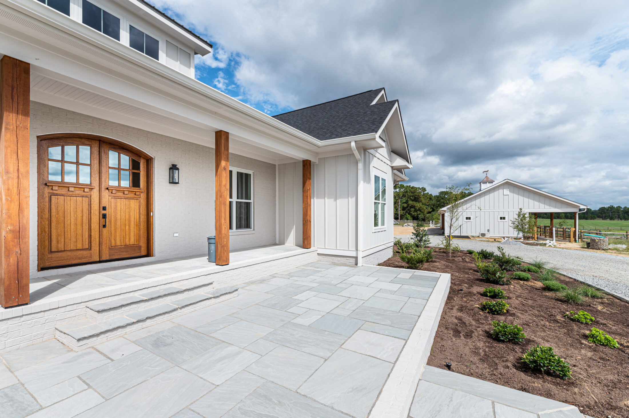 Covered outdoor living area at a Southern Pines equestrian custom home