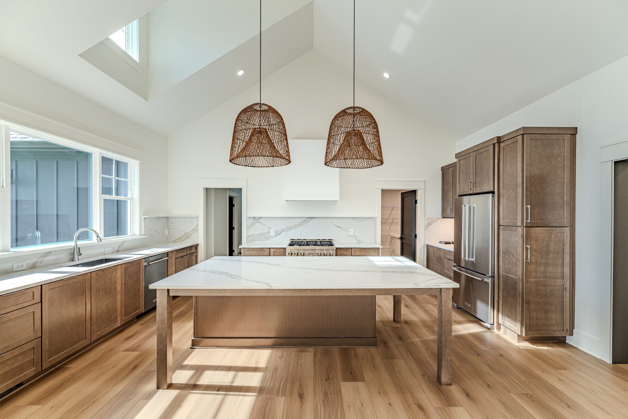 Custom kitchen island and warm wood cabinetry