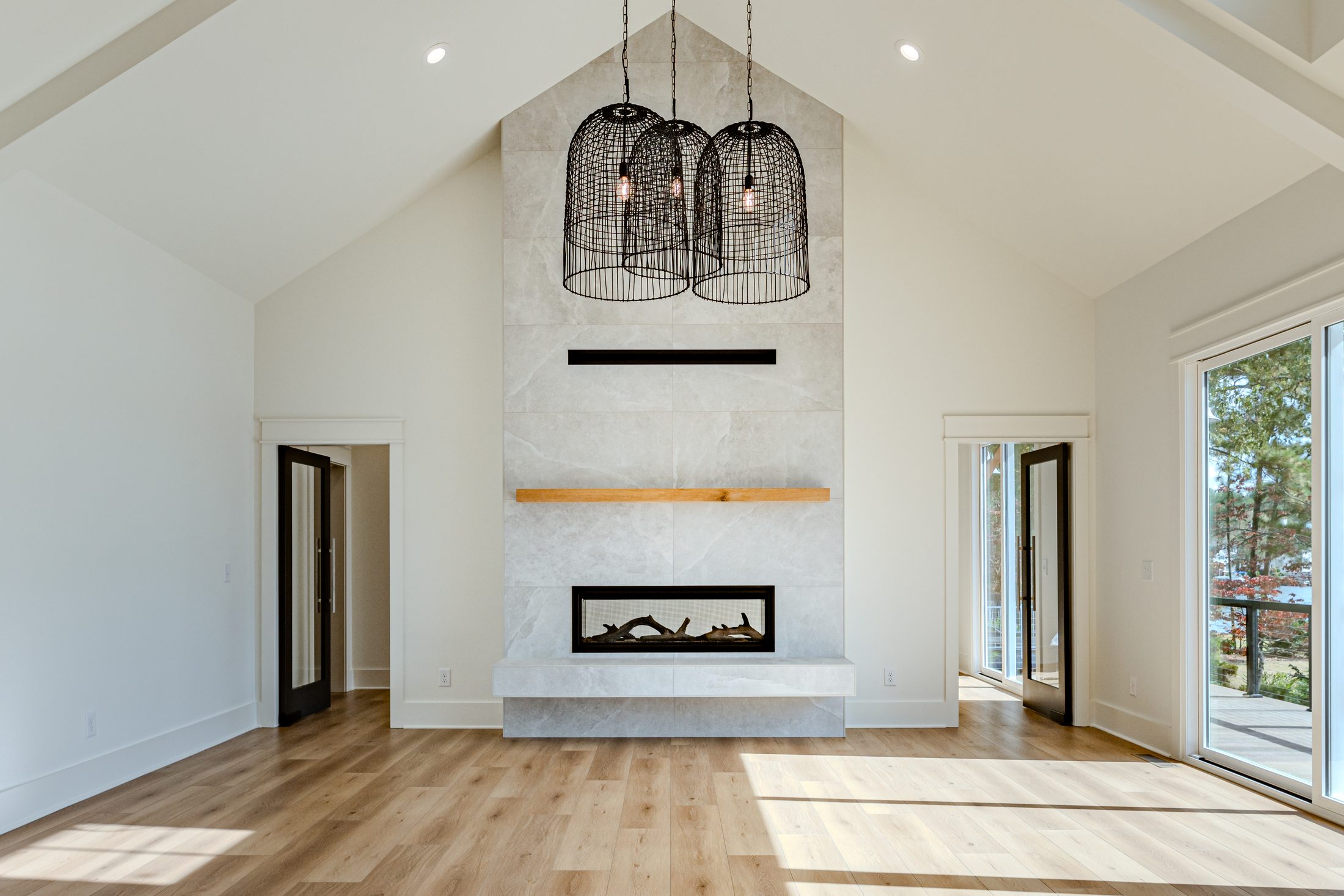 Centered fireplace detail in a light-filled great room