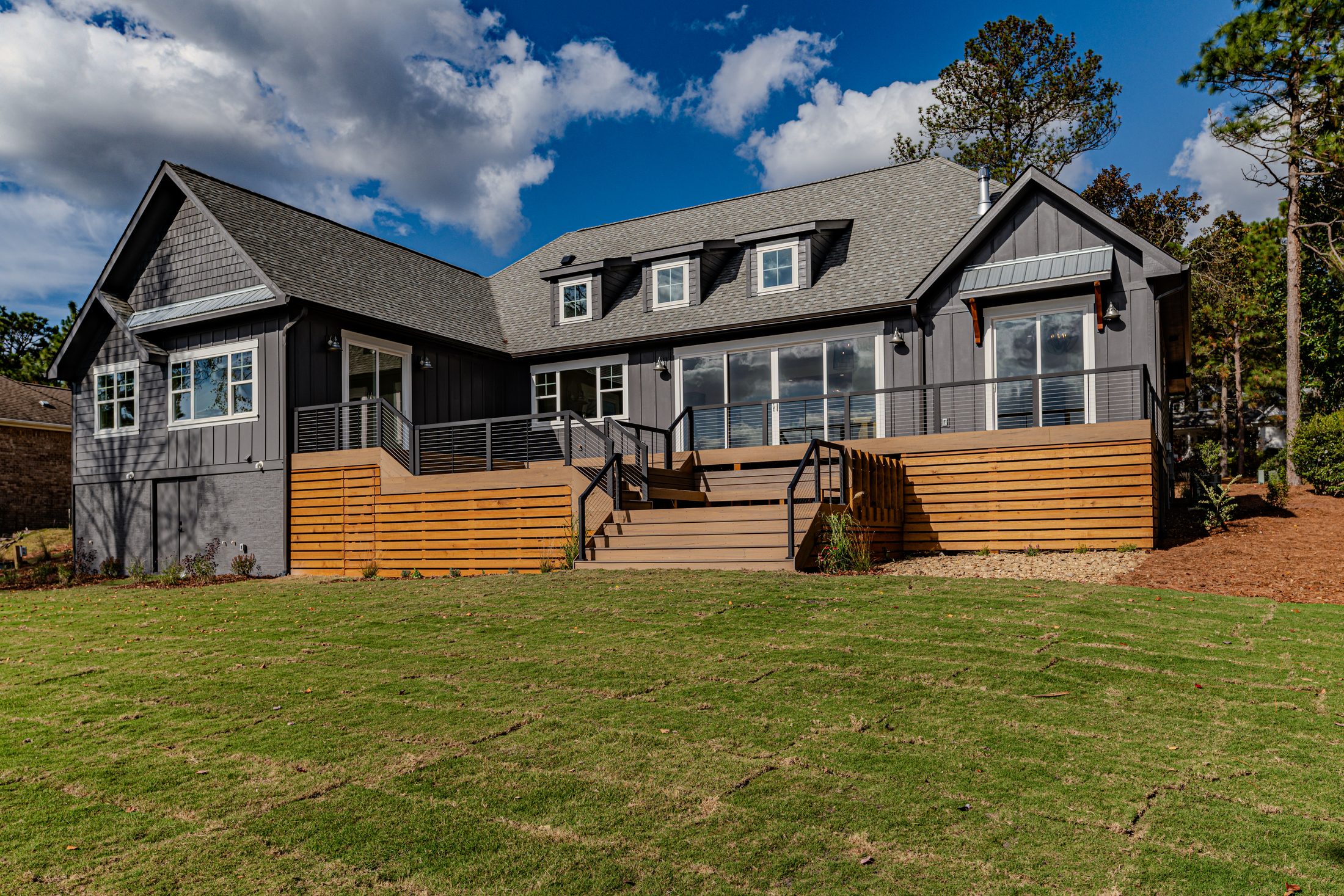 Rear lake-facing exterior of a classic custom home on Lake Auman in Seven Lakes, North Carolina