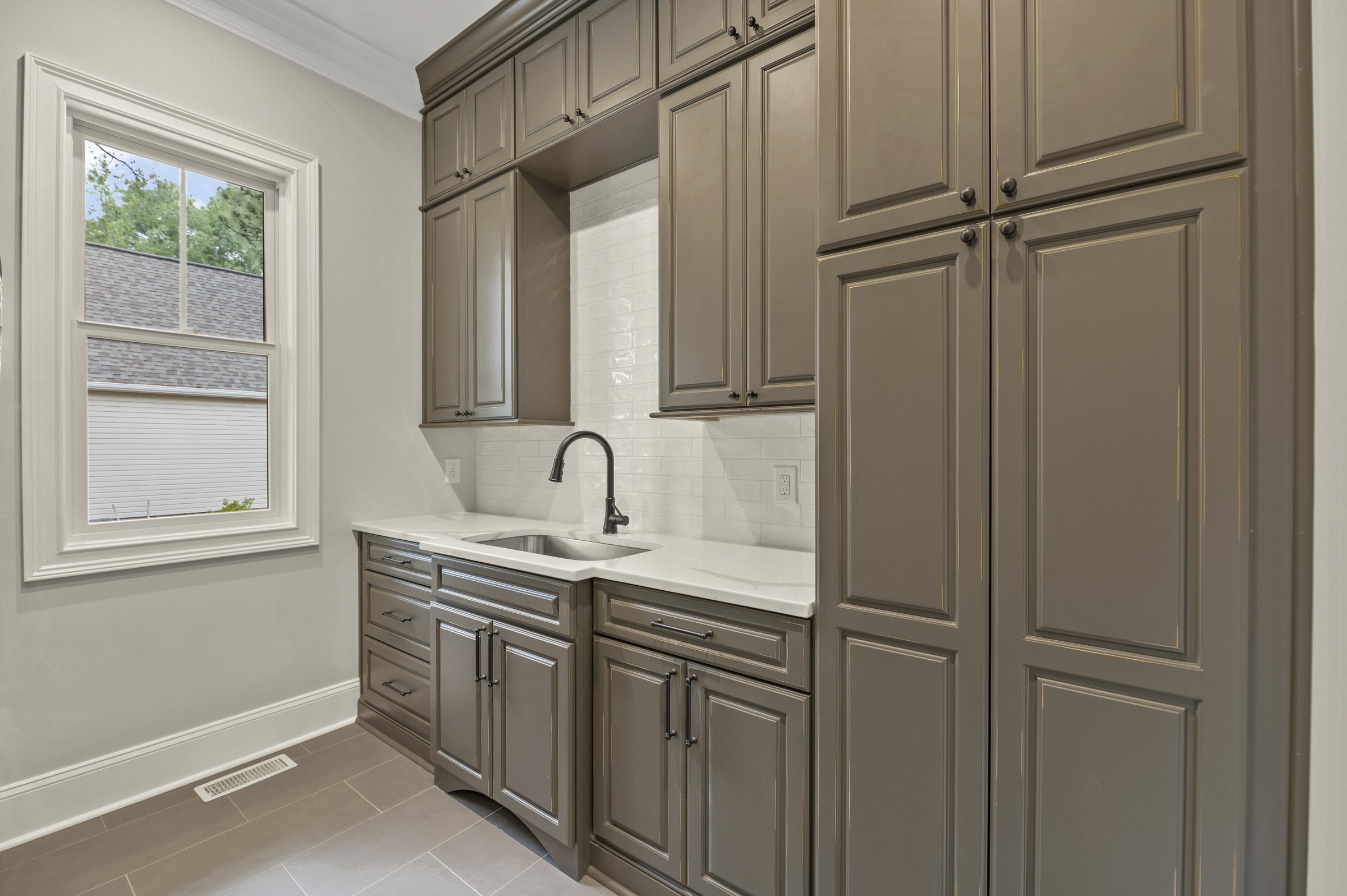 Lakeside custom home on Lake Auman in Seven Lakes NC — custom cabinetry and bar
