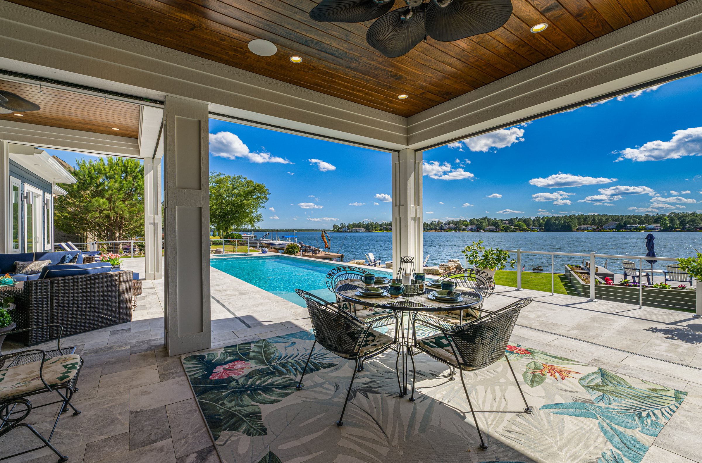 Outdoor living custom home on Lake Auman in Seven Lakes NC — covered outdoor living