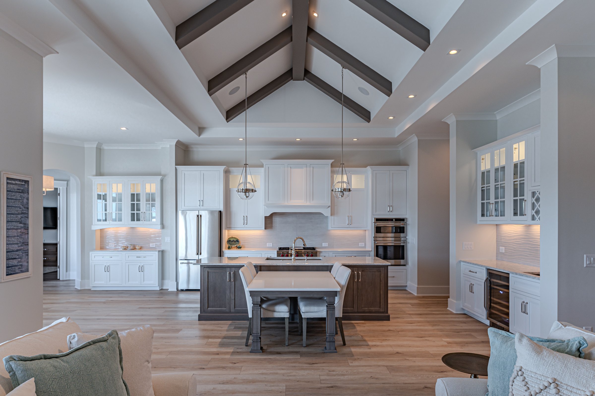 Outdoor living custom home on Lake Auman in Seven Lakes NC — kitchen and living area