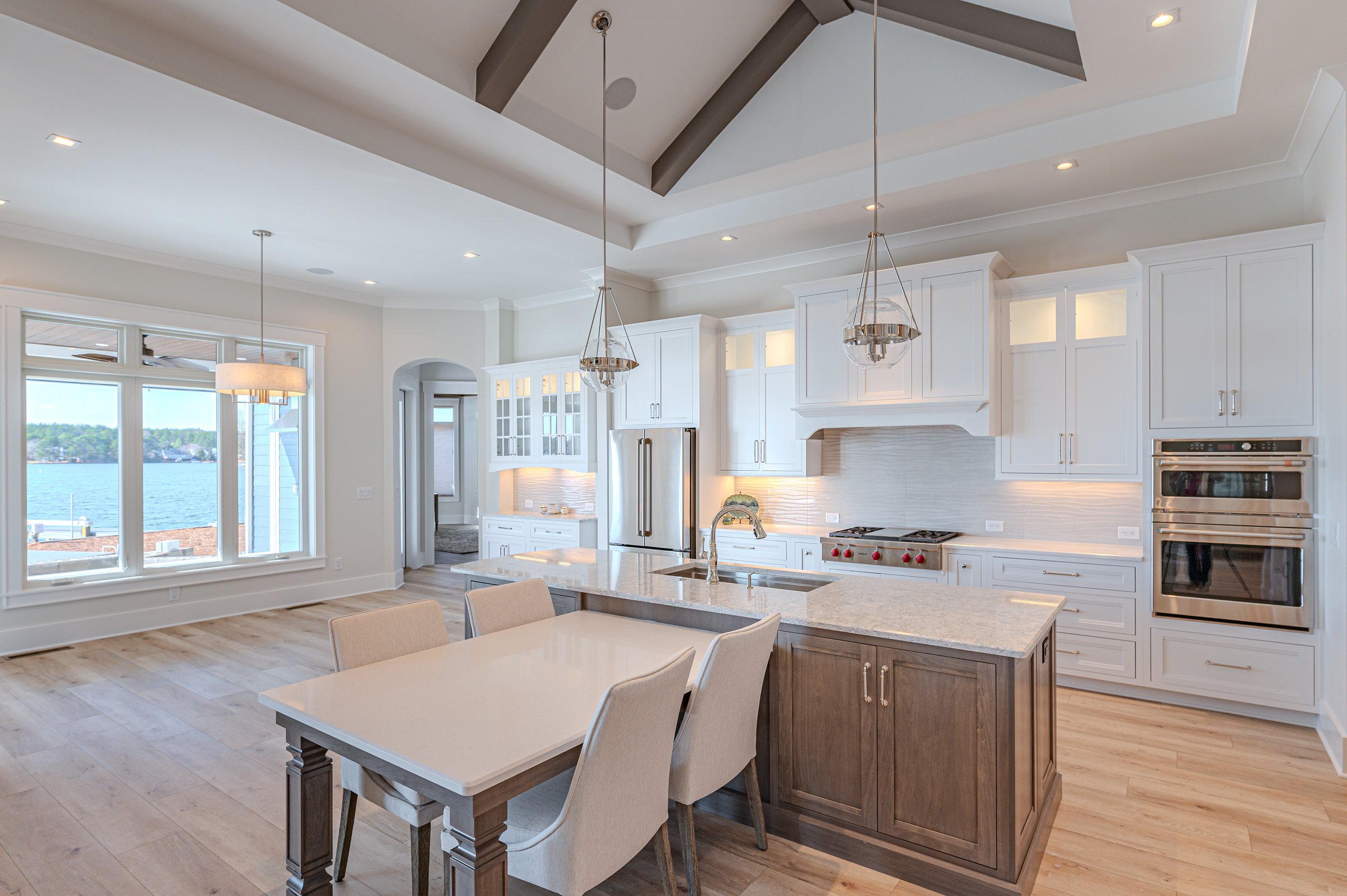 Outdoor living custom home on Lake Auman in Seven Lakes NC — kitchen island