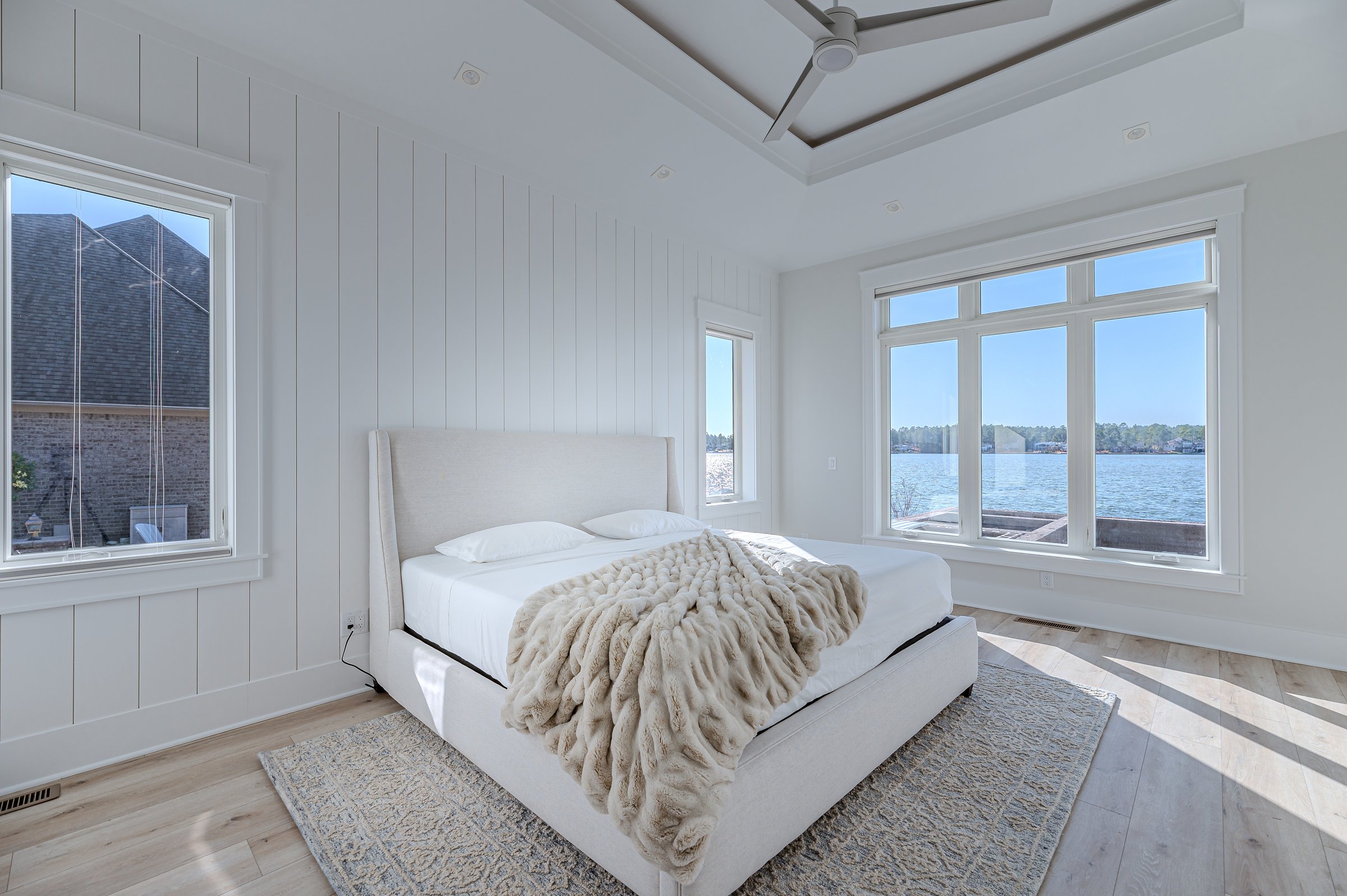 Outdoor living custom home on Lake Auman in Seven Lakes NC — bedroom with lake view