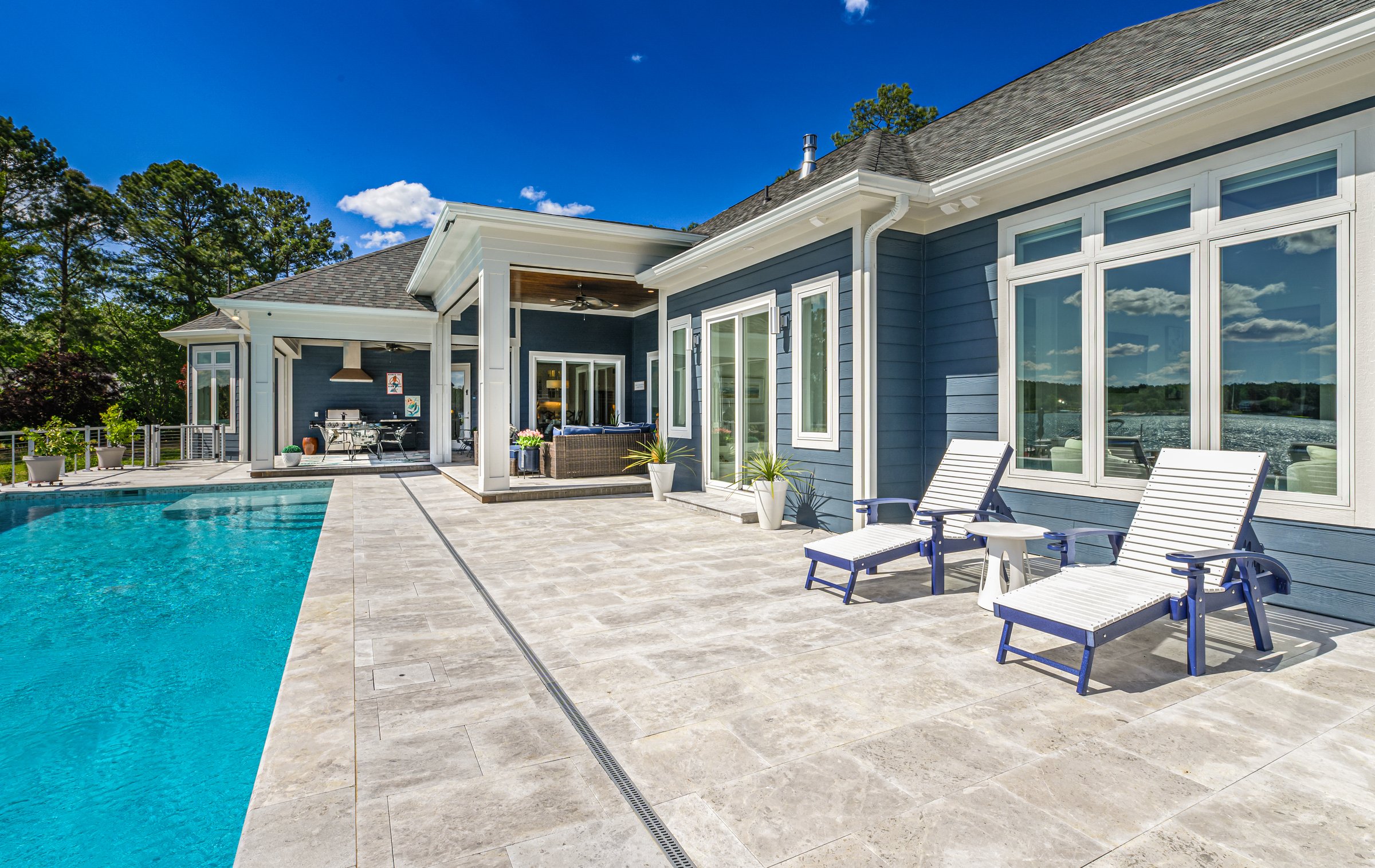 Outdoor living custom home on Lake Auman in Seven Lakes NC — pool and patio