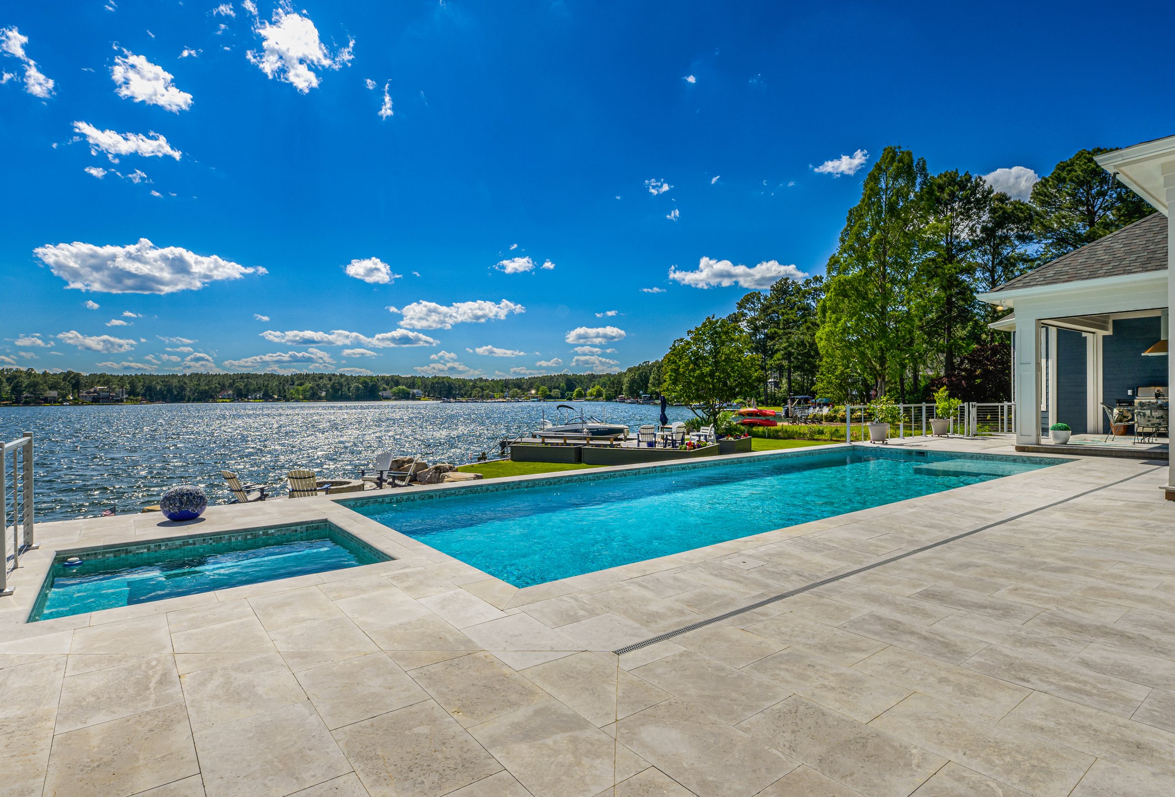 Outdoor living custom home on Lake Auman in Seven Lakes NC — pool view