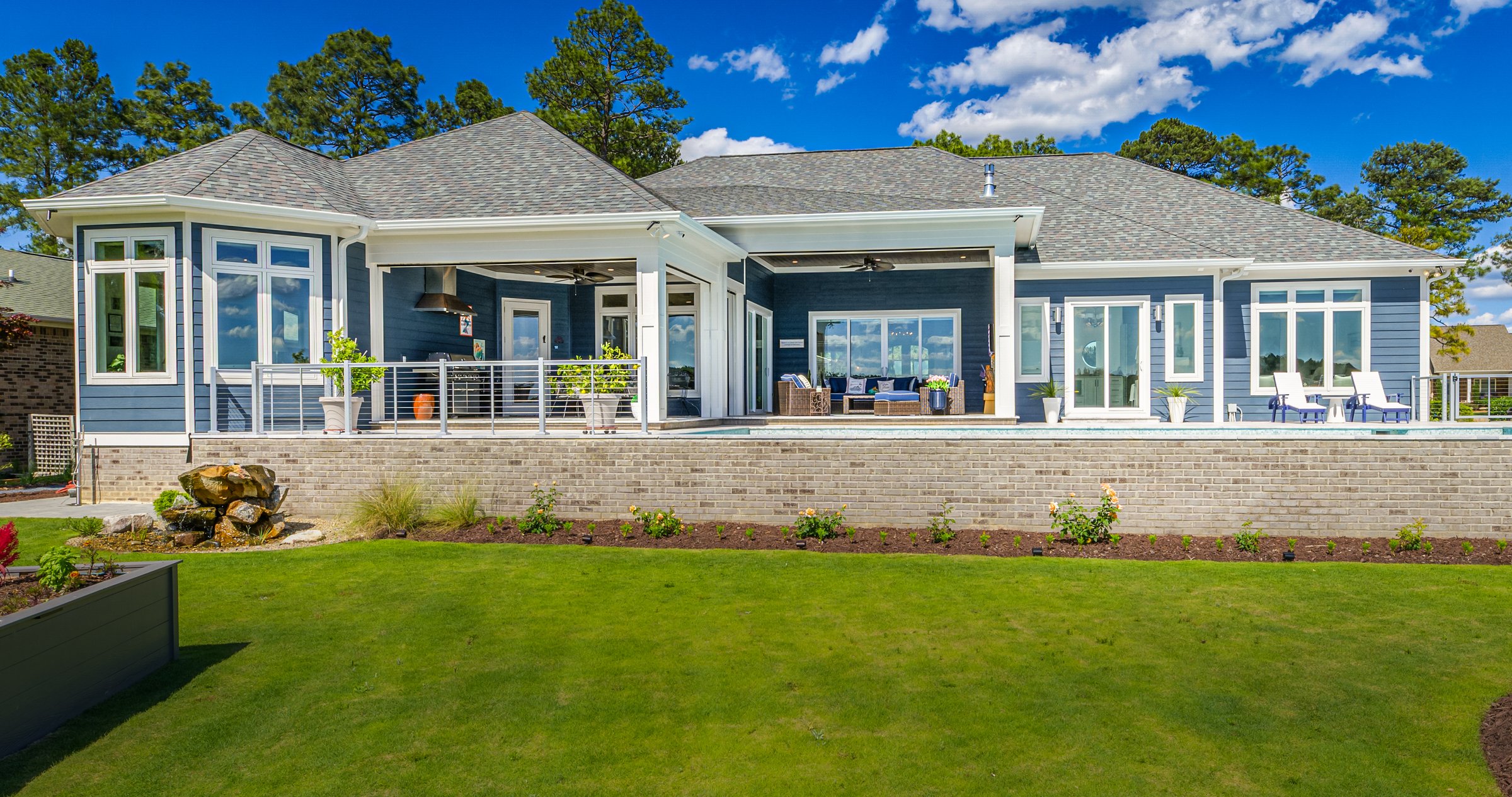 Outdoor living custom home on Lake Auman in Seven Lakes NC — rear exterior