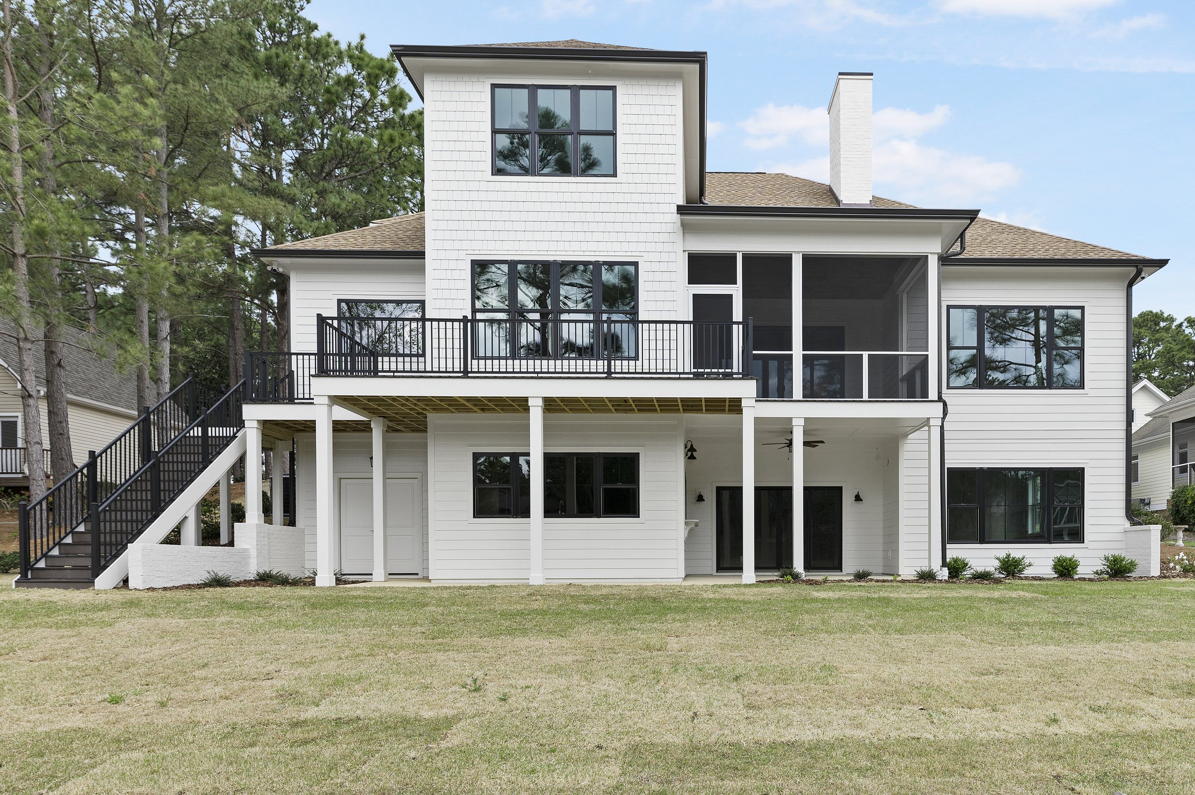 Lakeside custom home on Lake Auman in Seven Lakes NC — rear exterior