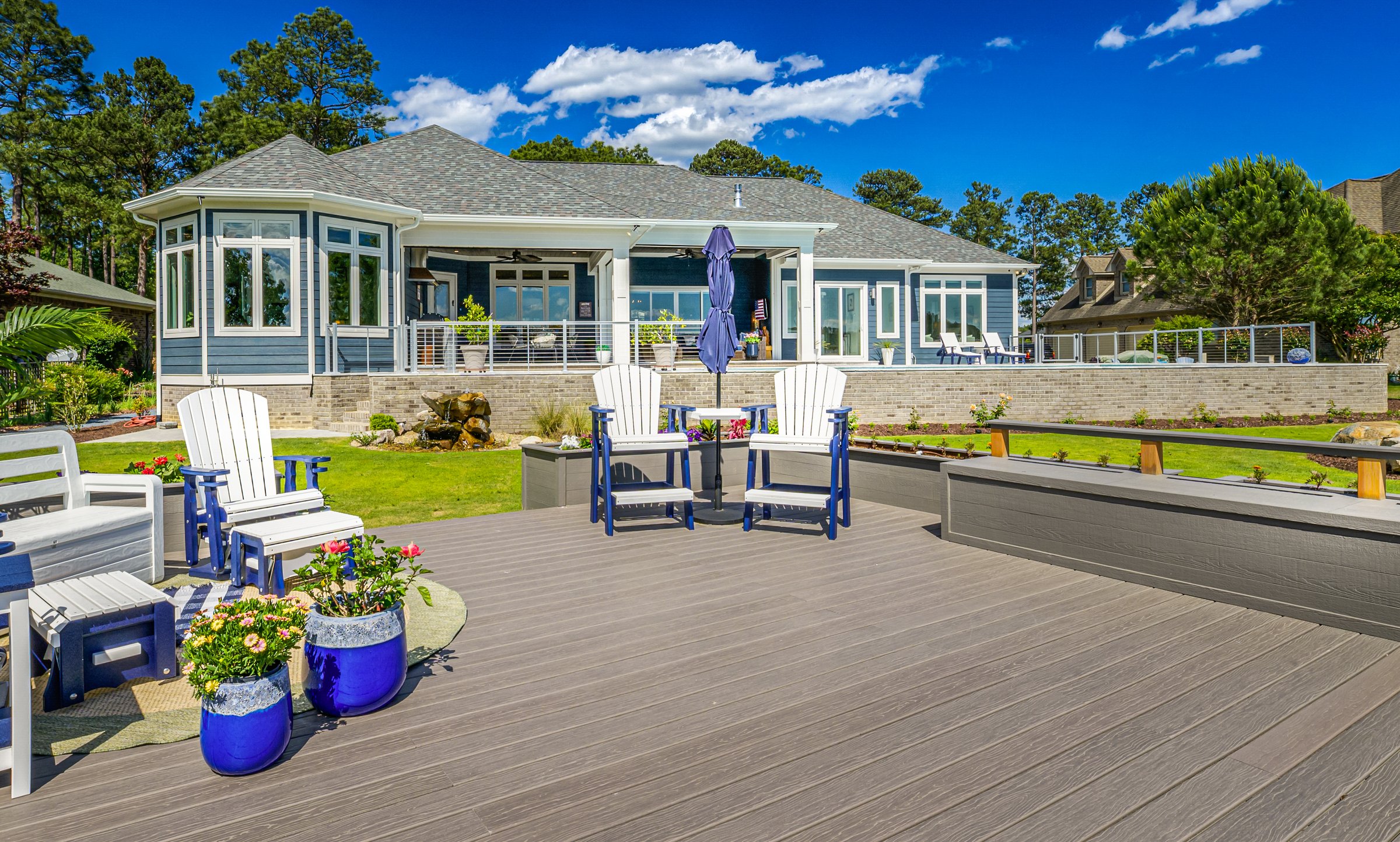 Outdoor living custom home on Lake Auman in Seven Lakes NC — rear outdoor living