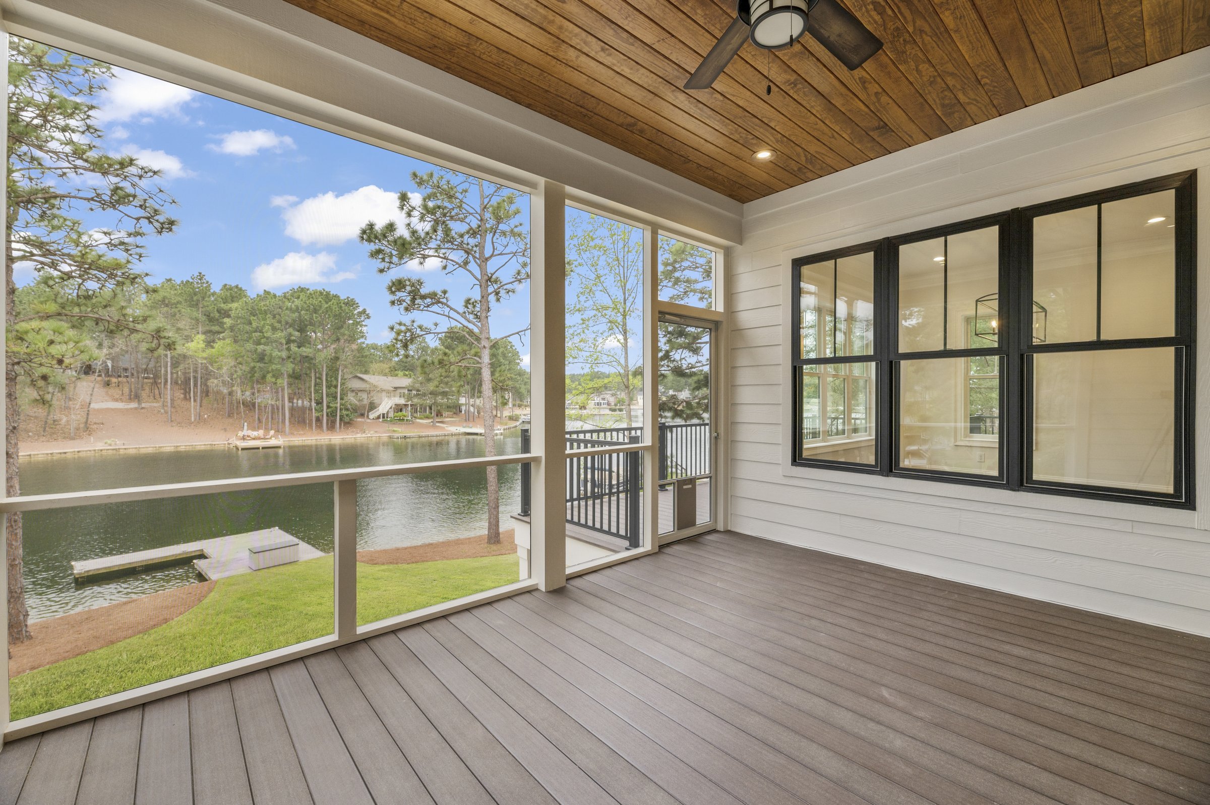 Lakeside custom home on Lake Auman in Seven Lakes NC — screened porch