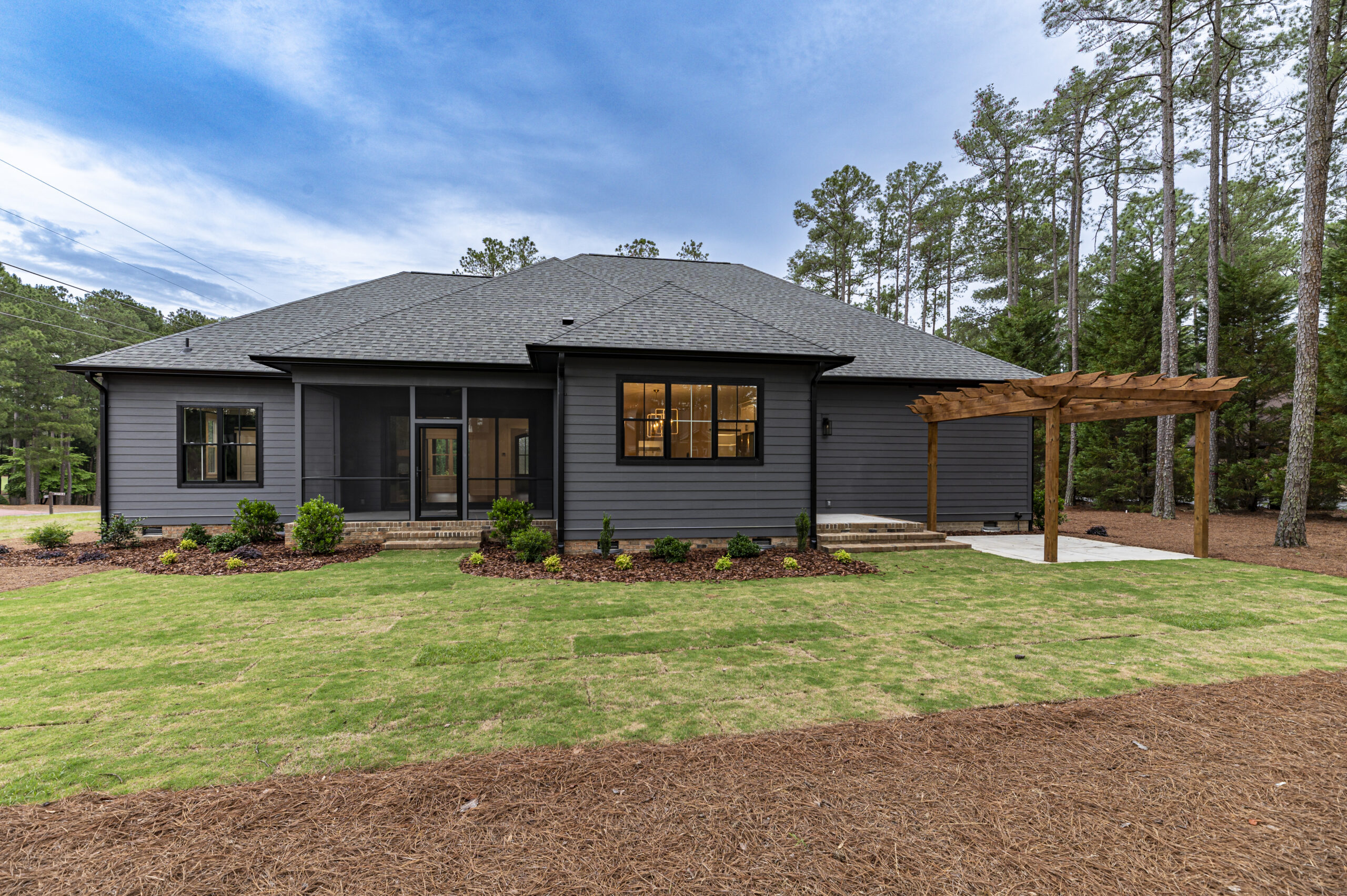 Rear elevation and pergola of a custom home in Pinehurst, North Carolina