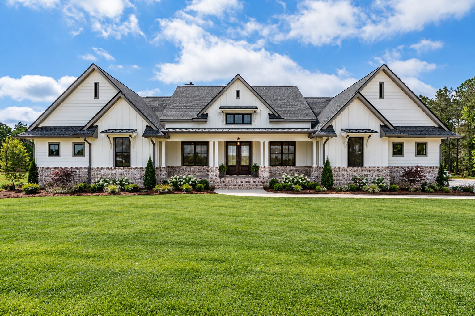 Wide front exterior of a traditional custom home in Grande Pines, Foxfire NC