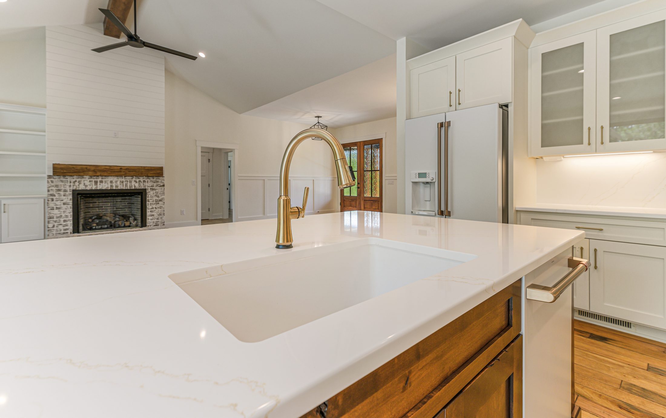 Kitchen sink and island overlooking the great room fireplace