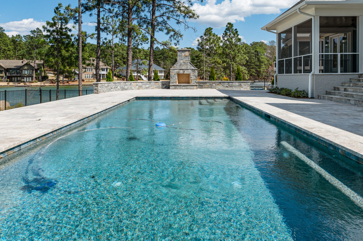 Poolside custom home on Lake Auman in Seven Lakes NC with outdoor living area overlooking the lake